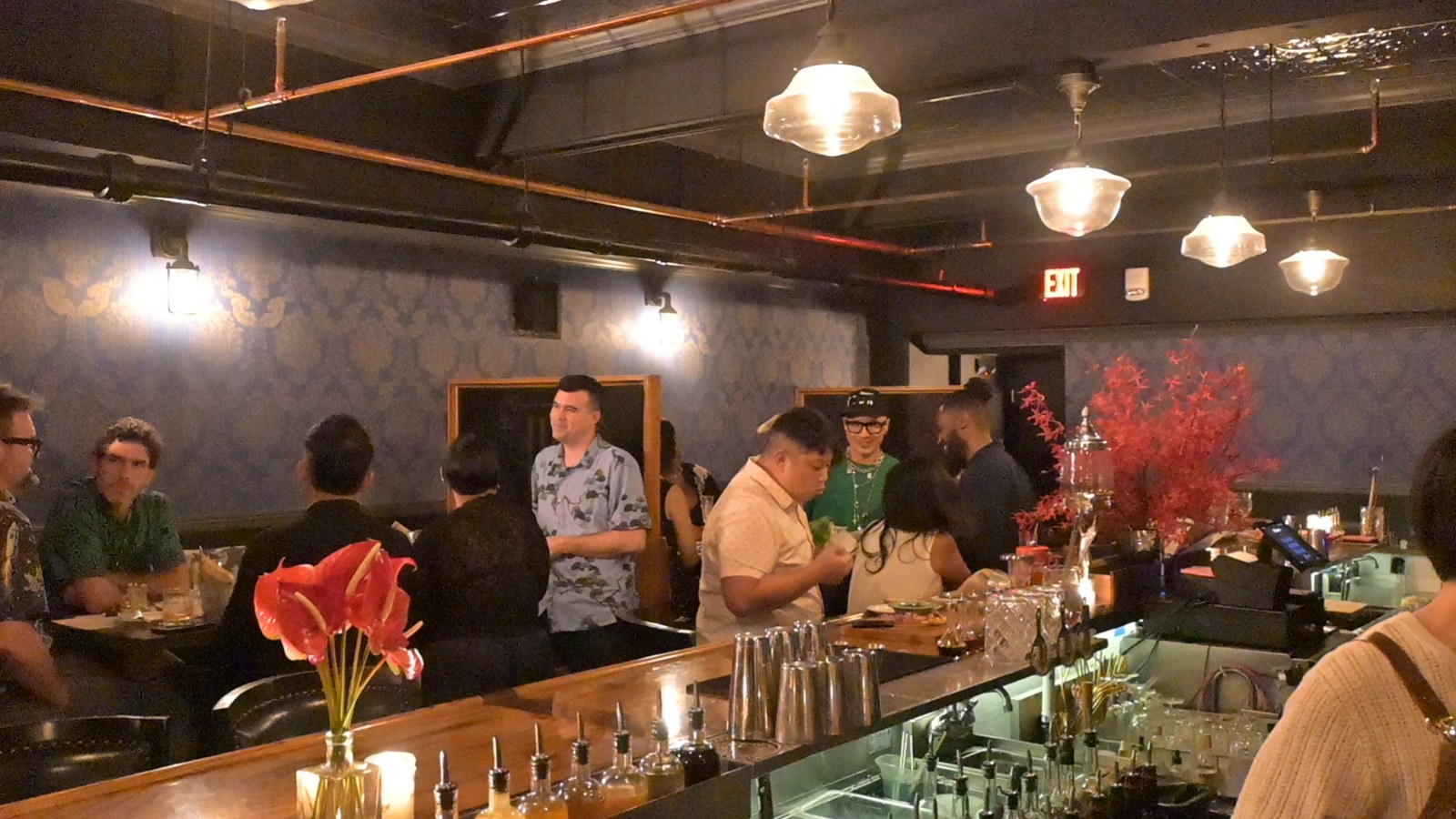 The Hush Hush bar, red anthuriums in front