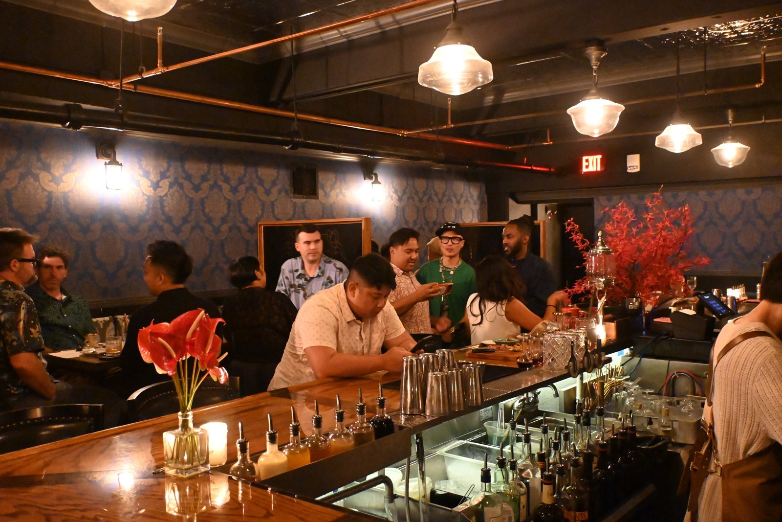 Guests along the counter at the VIP reception