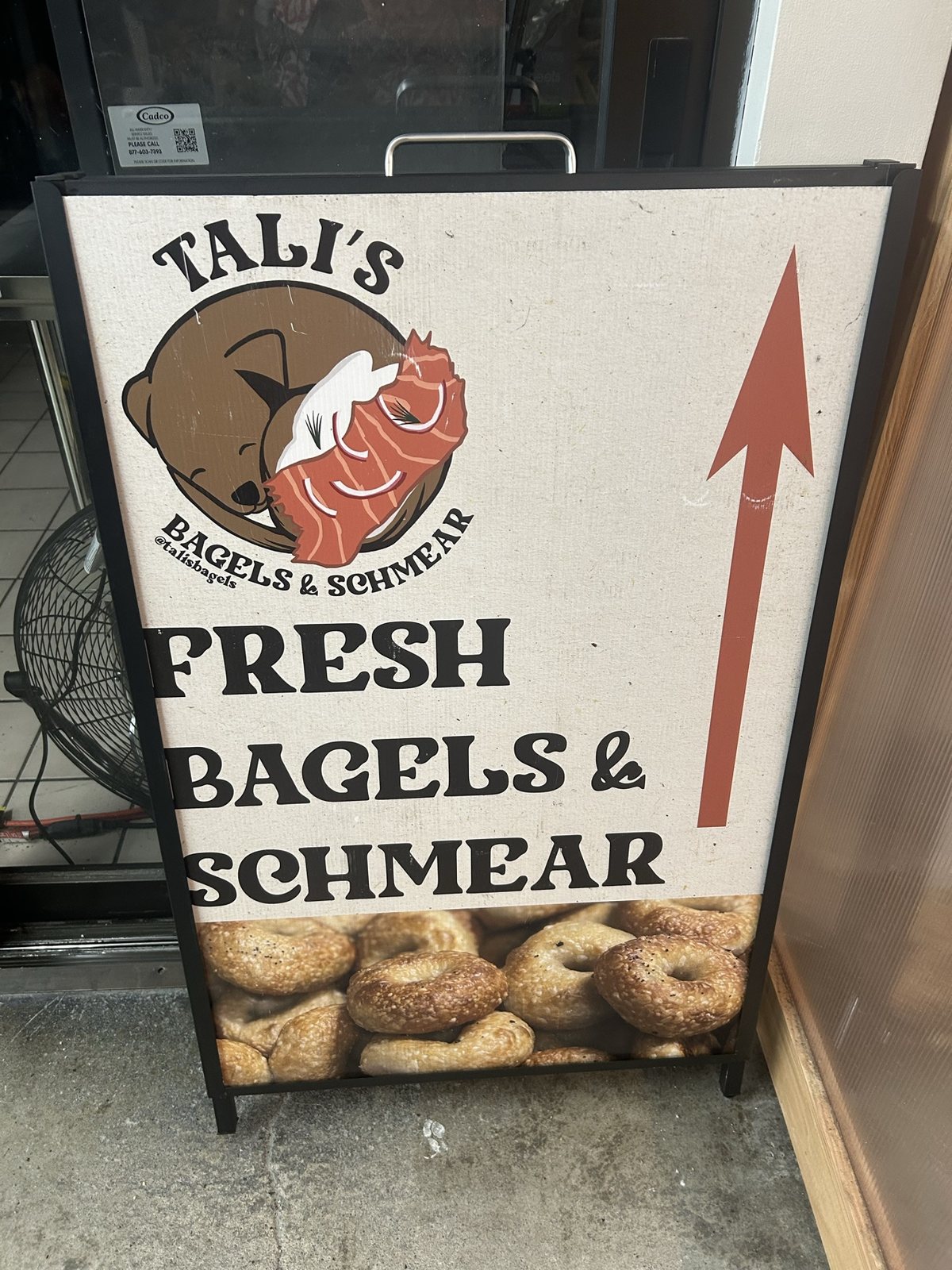 An A-frame sign for Tali's Bagels & Schmear