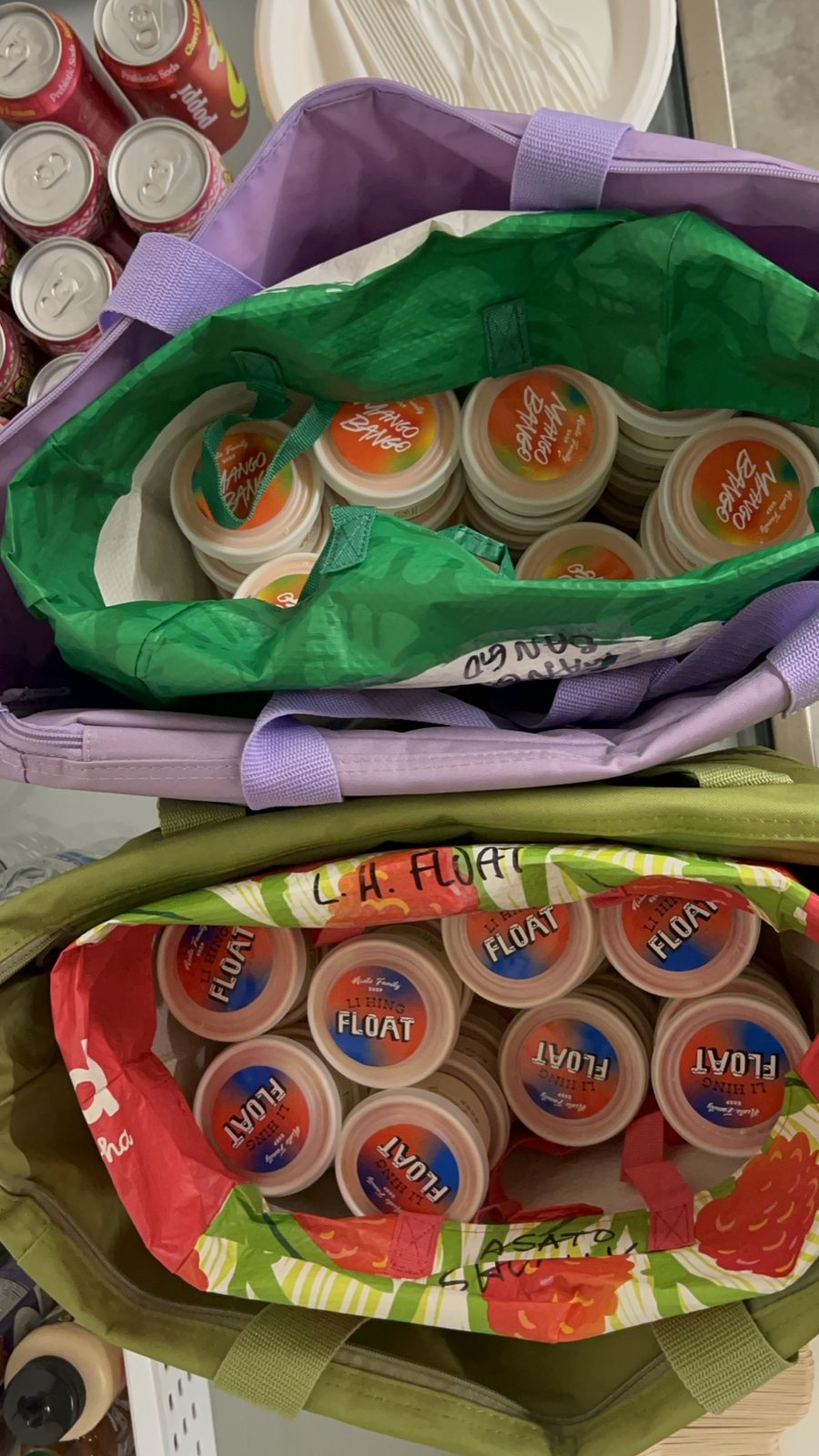 Reusable bags of snack cups and a cooler