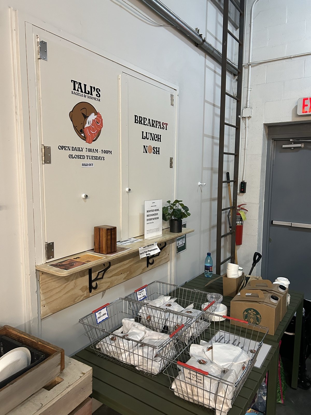 Tali's Bagels & Schmear signage on the kitchen cupboards