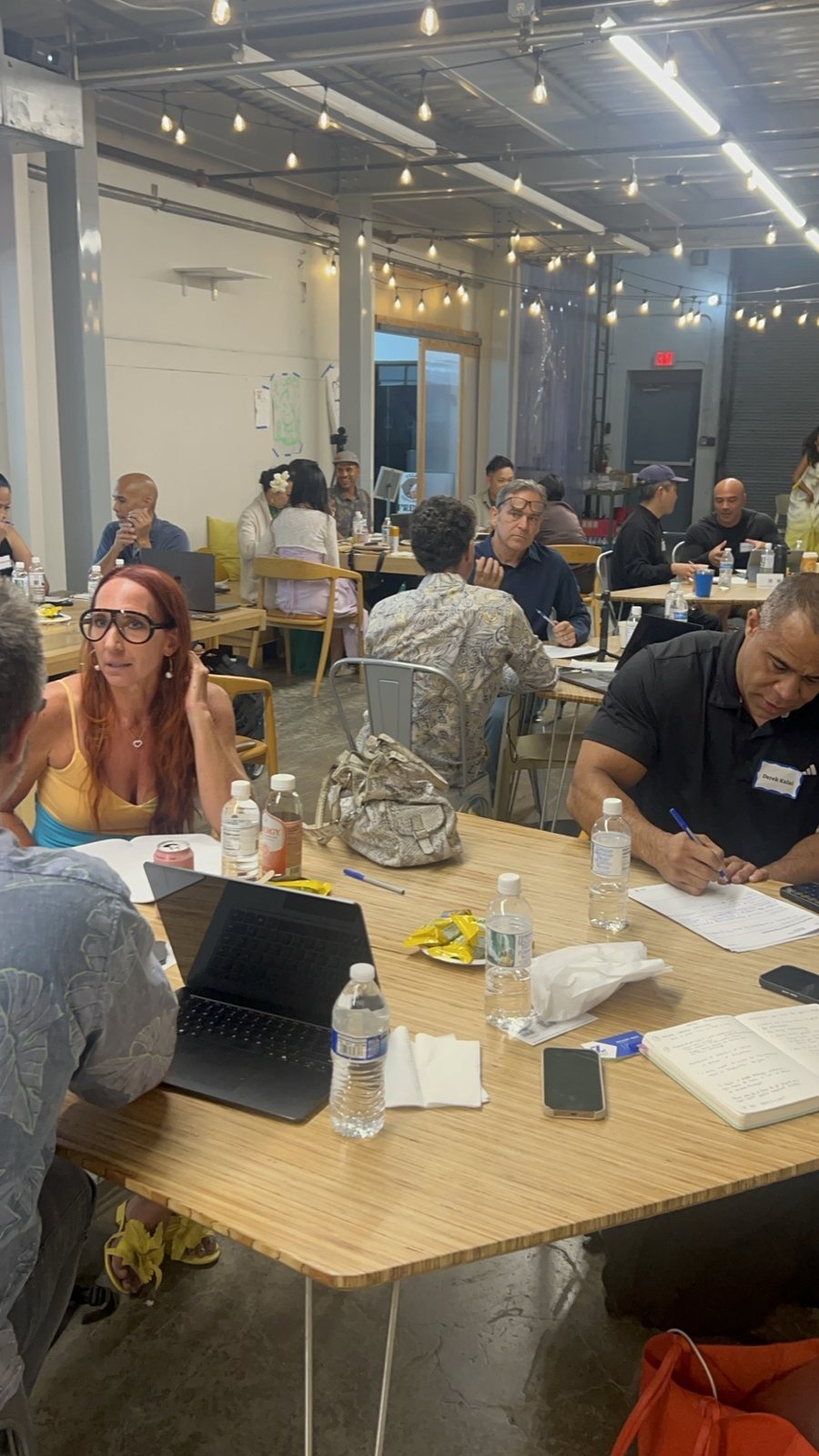 Attendees working at a group table