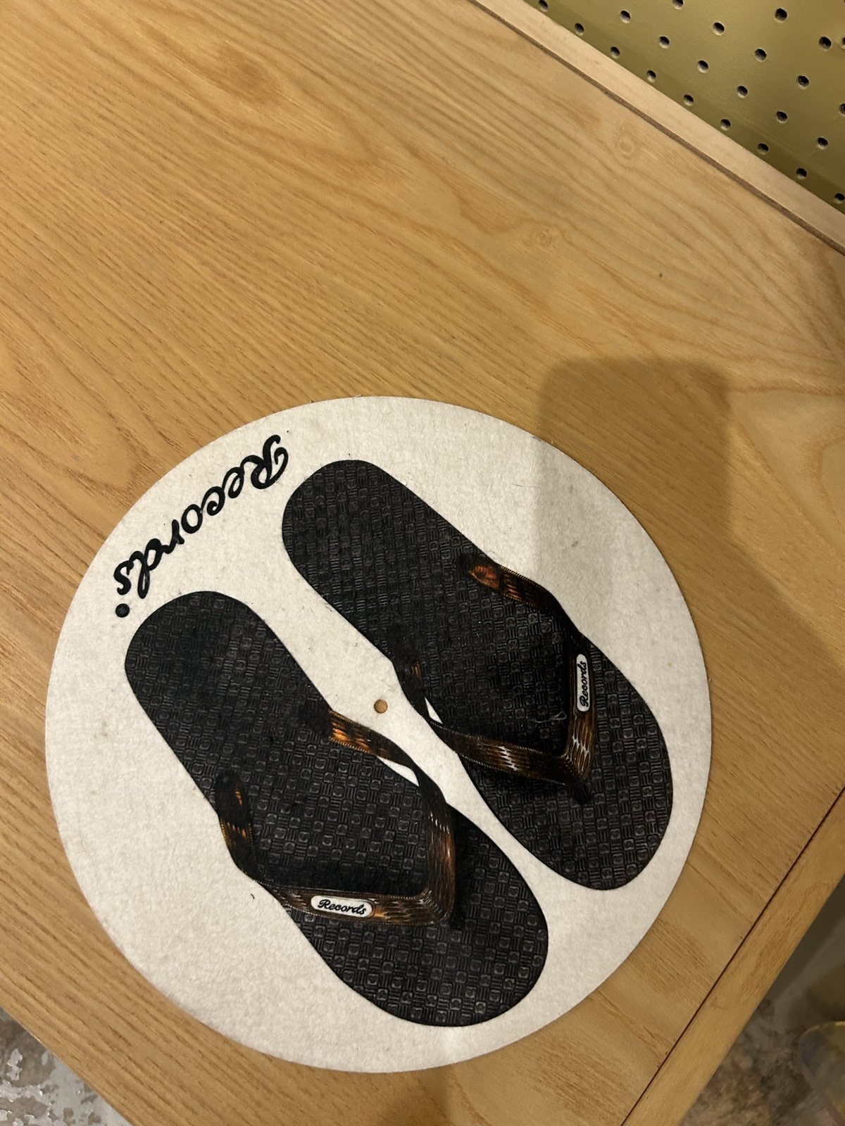 A "Records" slipmat with flip-flops printed on it