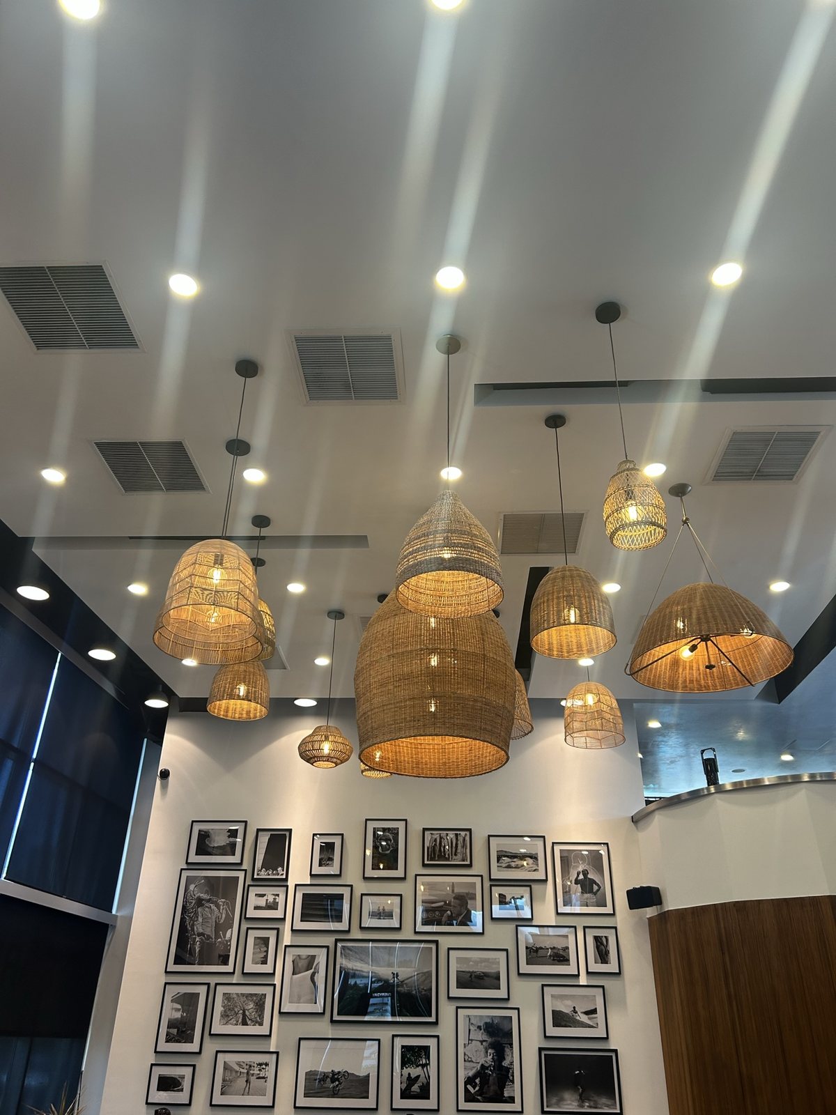 Woven pendant lights above the lounge