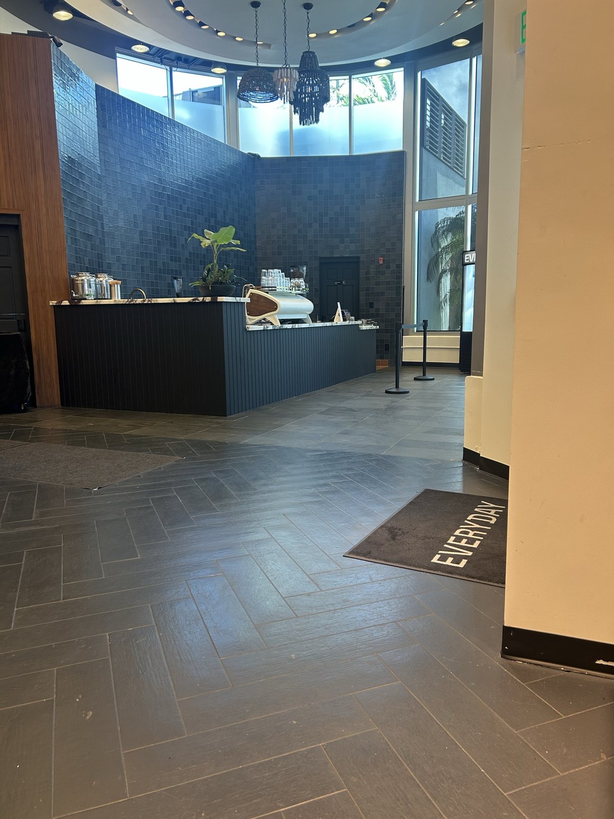 The lobby's herringbone floor and coffee bar