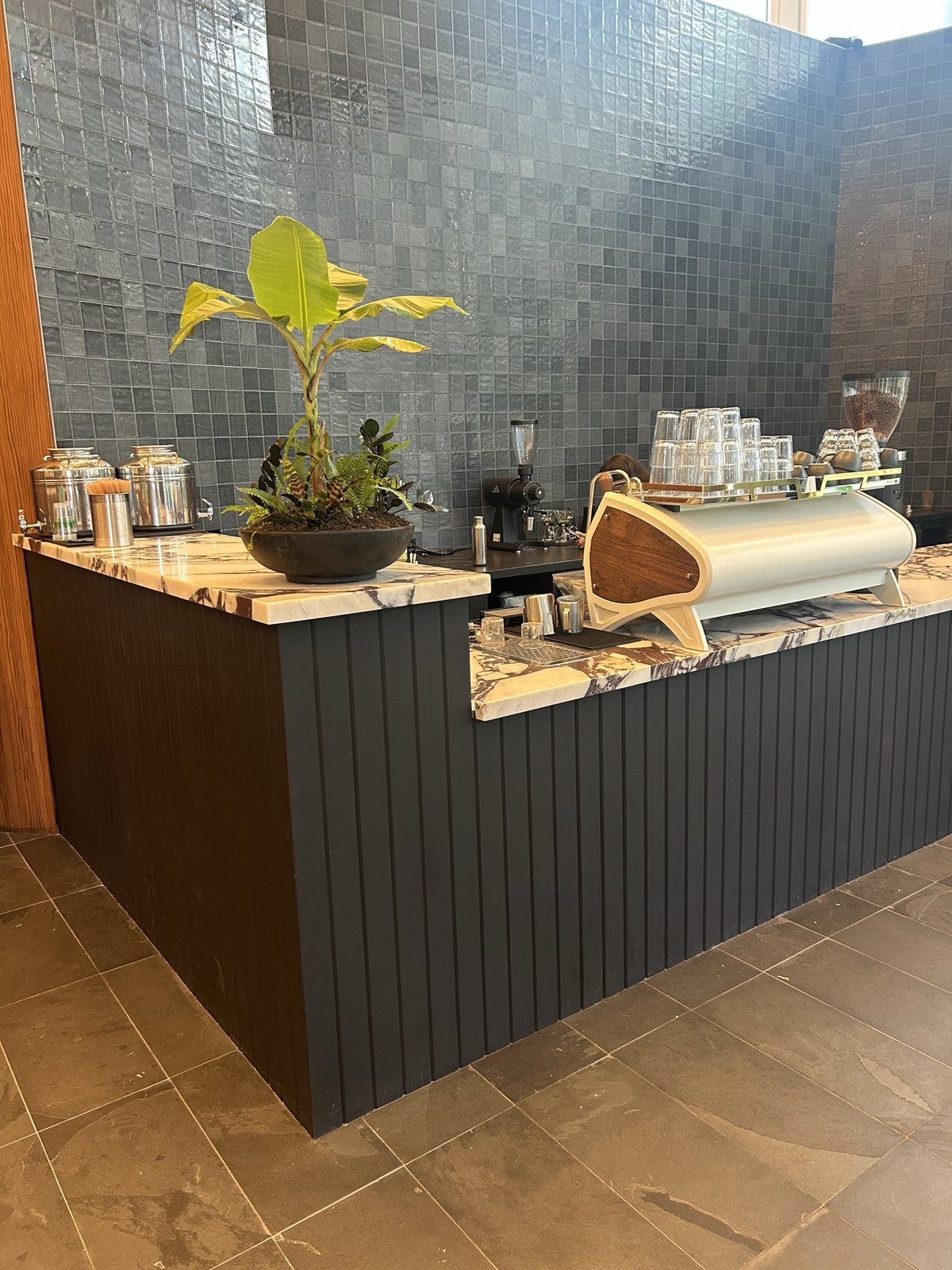The coffee bar counter and tiled wall