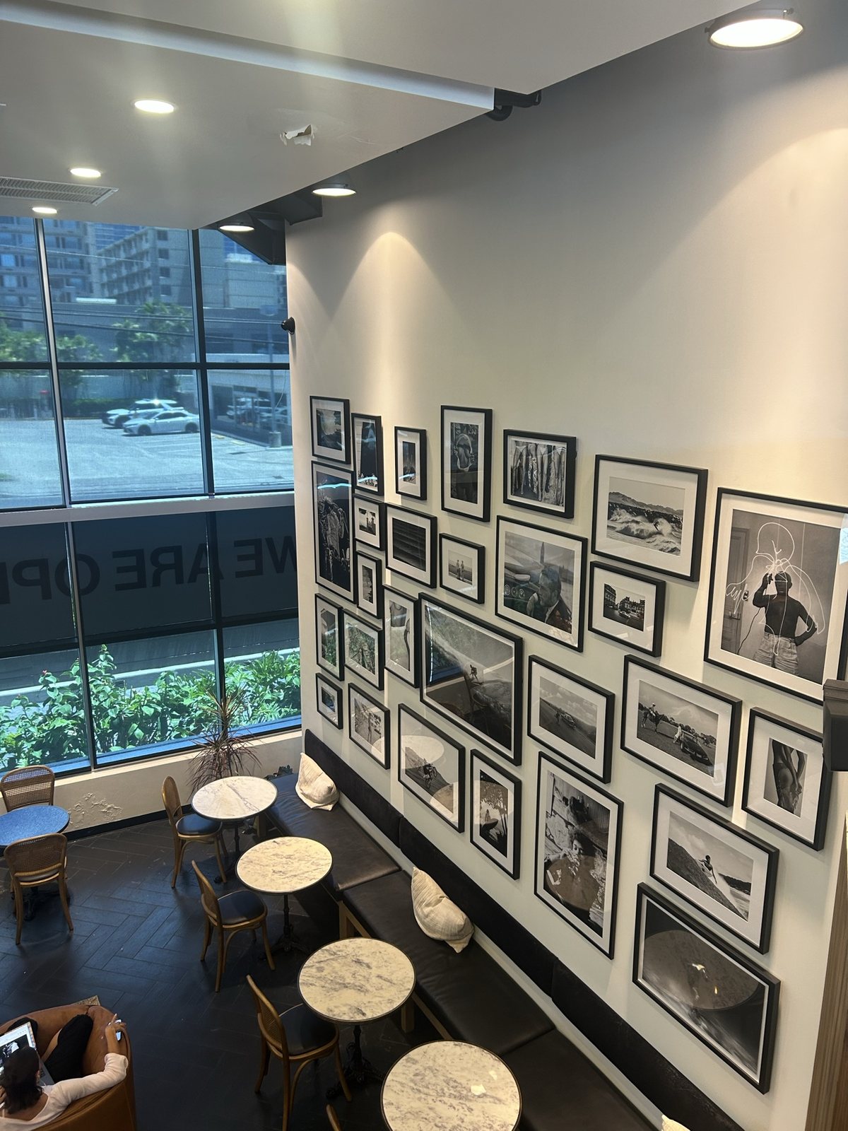 The framed photo wall seen from above