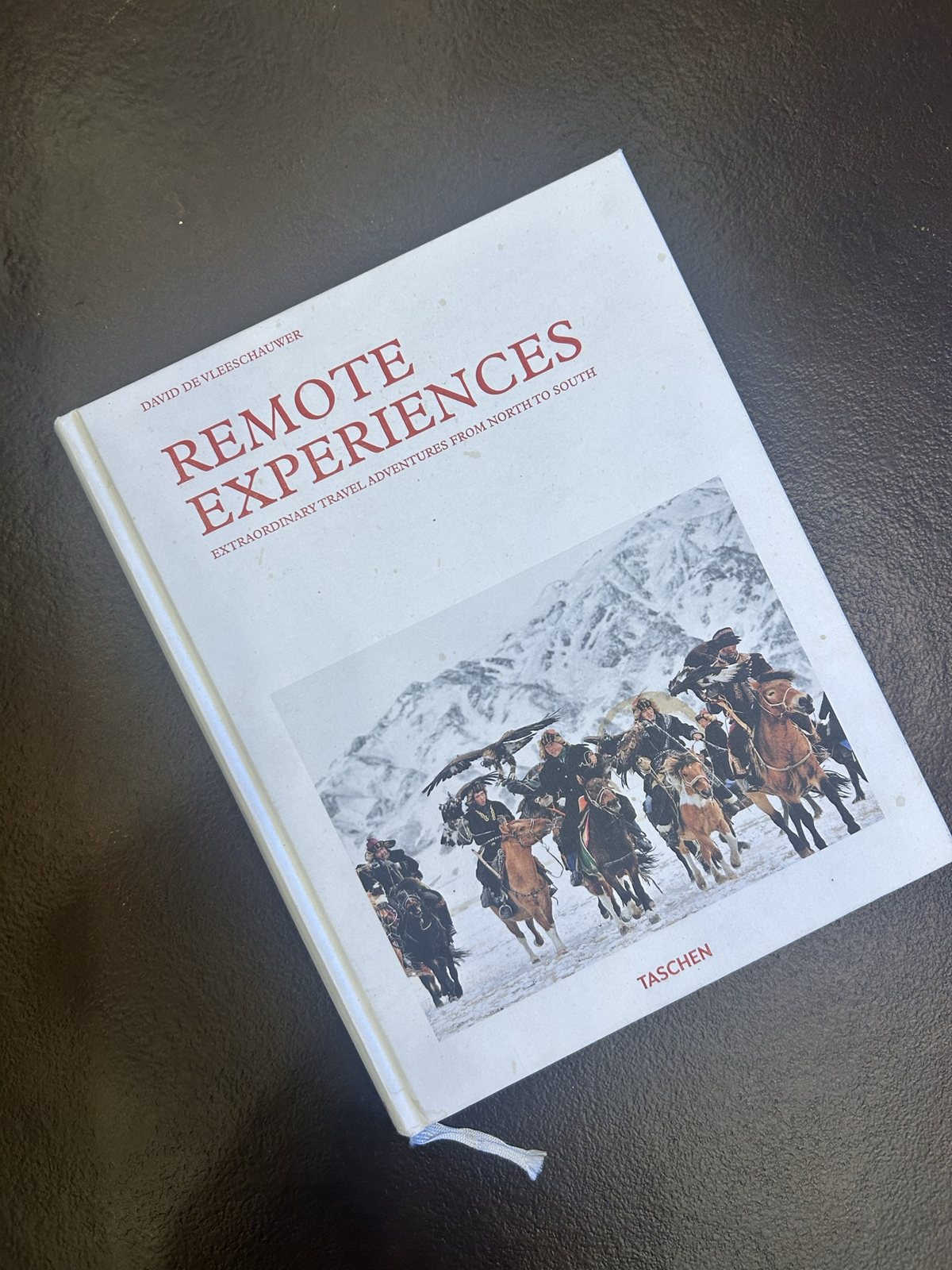 The book "Remote Experiences" on a table