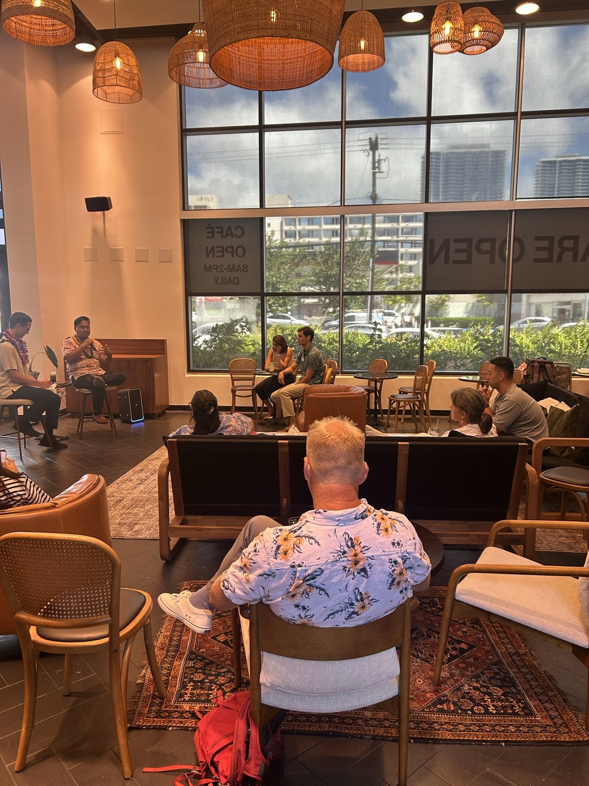 A guest in an aloha shirt watching the lounge session