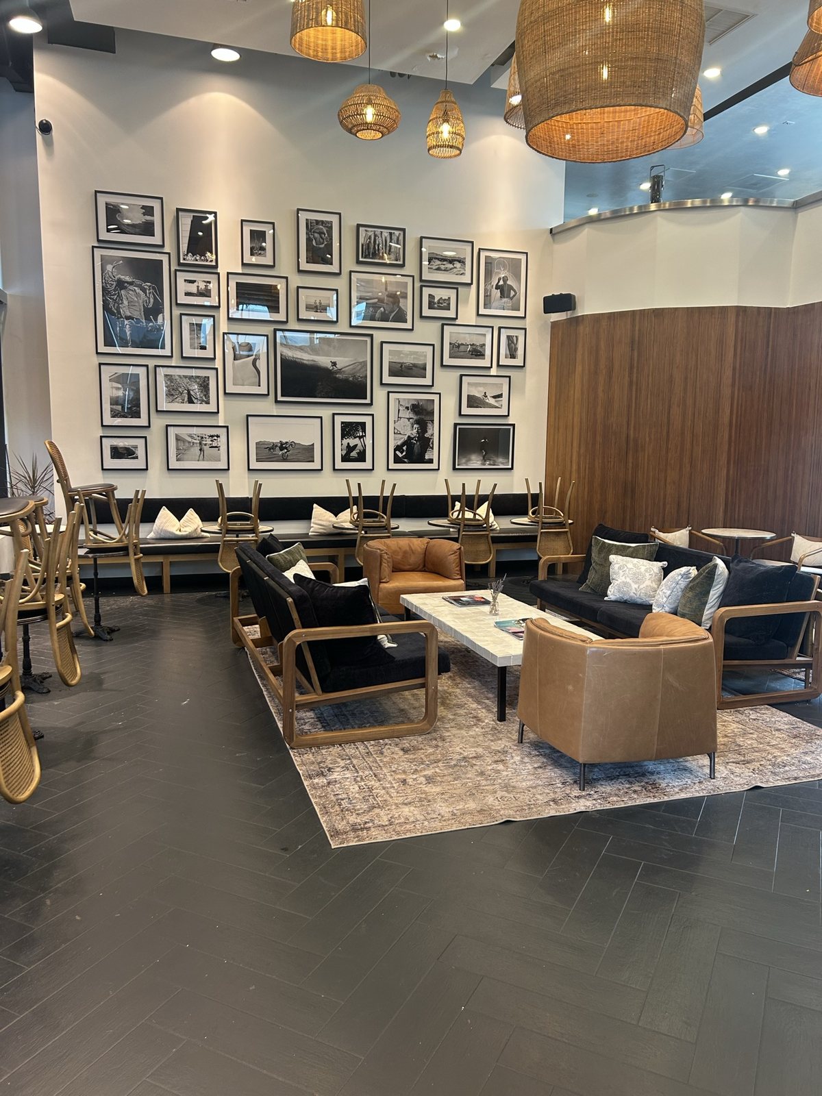 The lounge with the framed photo wall behind