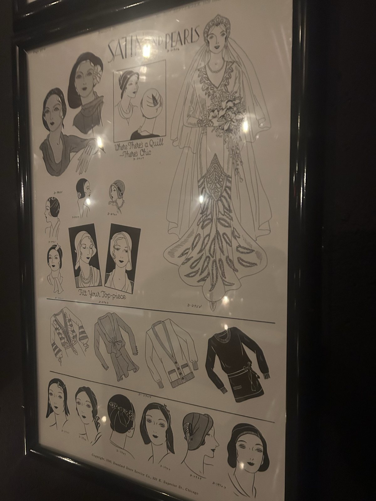 A framed vintage fashion print