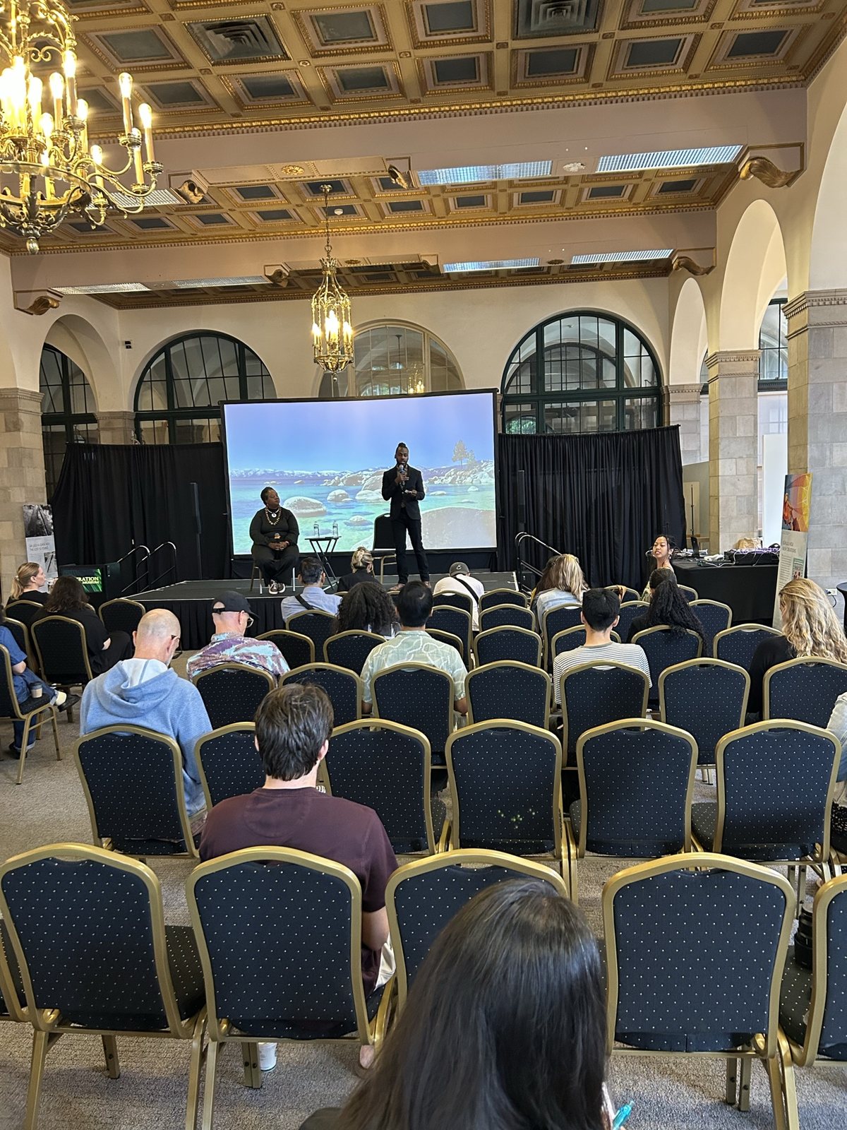 The grand hall during the session, screen at the front