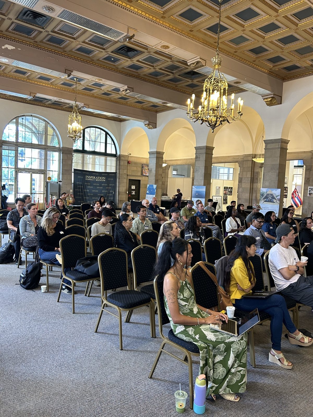 The hall from the audience, chandeliers above