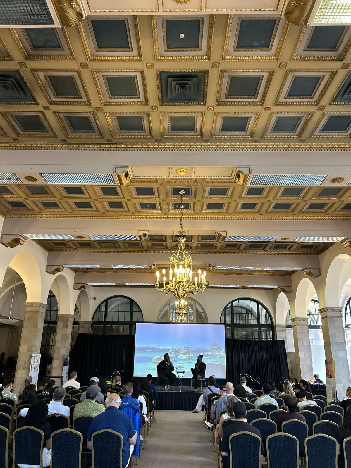The ceiling and chandelier over the audience