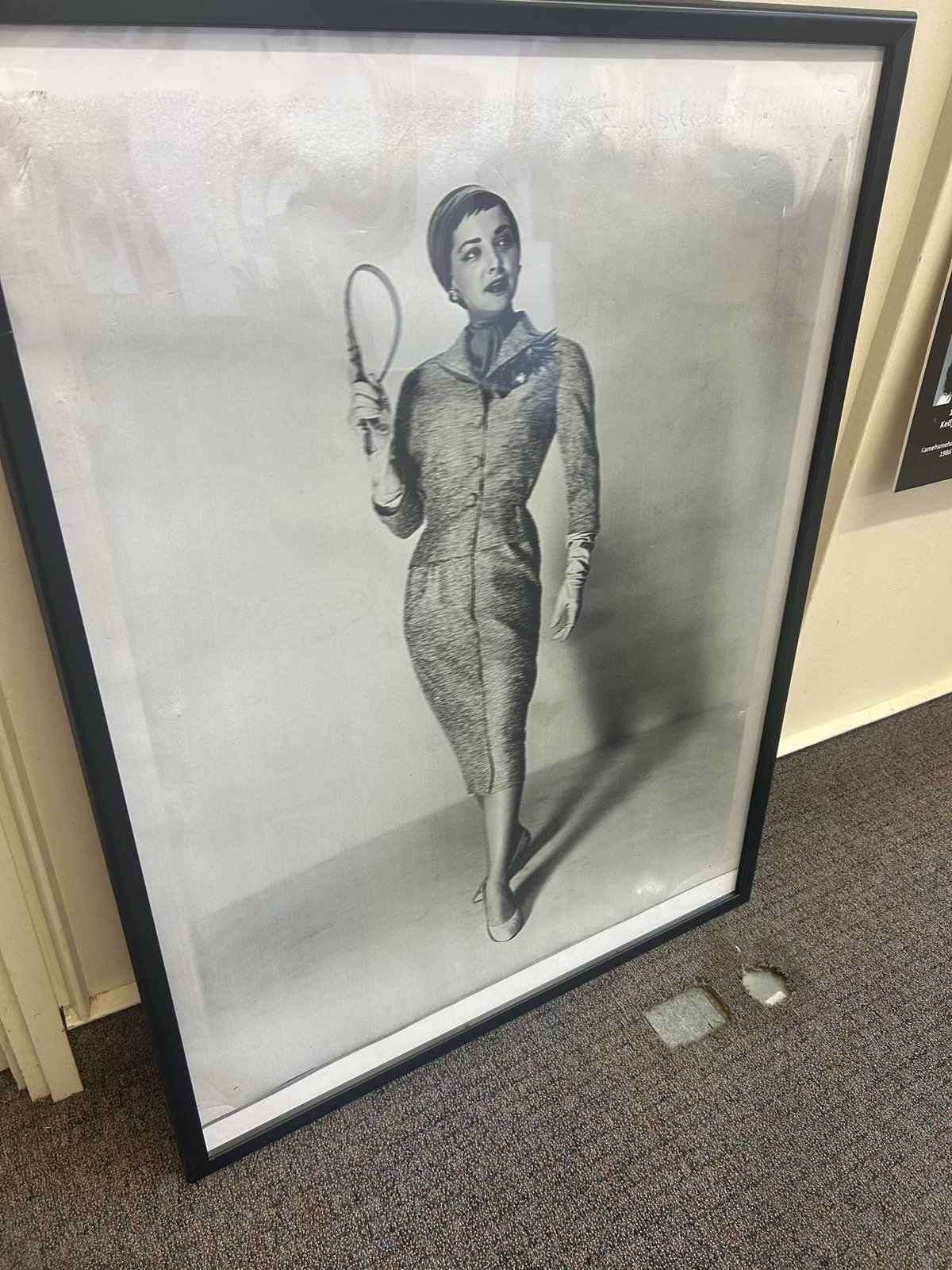 A framed vintage fashion photograph