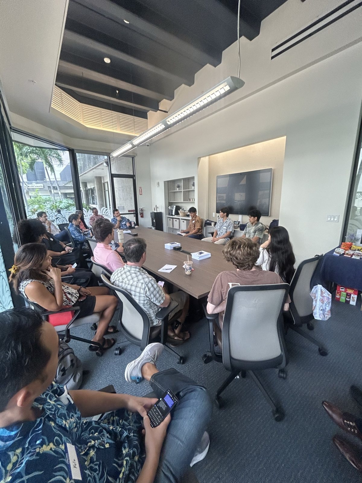 The panel room, attendees along the table